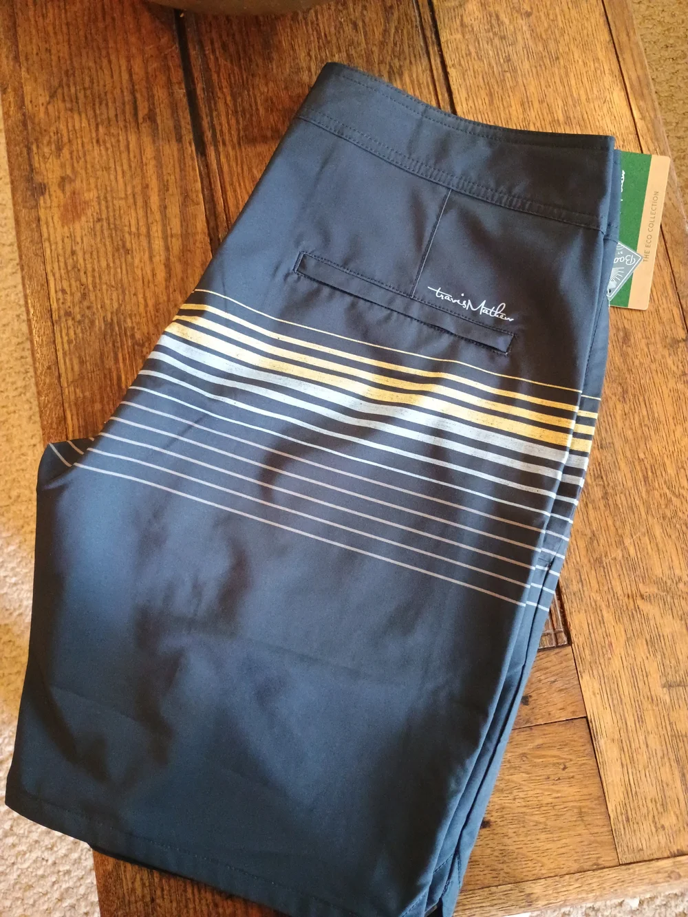 Travis Mathew Navy Blue Swim Board Shorts with White and Yellow Stripes